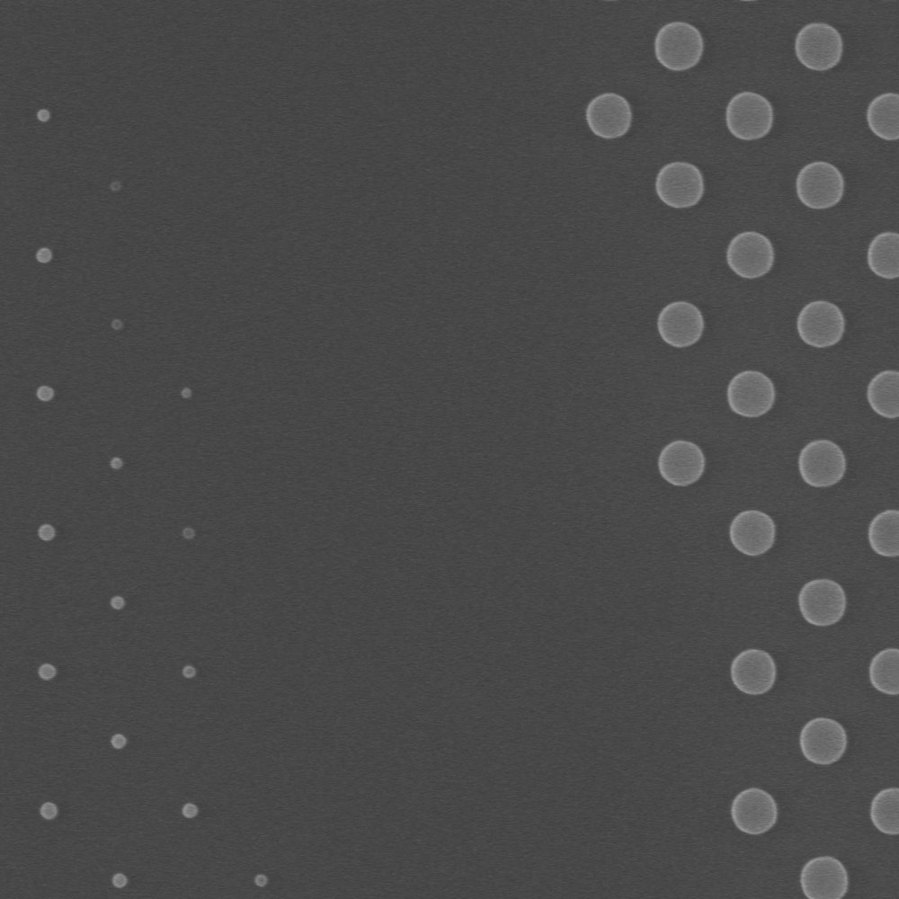 SEM of metalens structures without OPC: small features fail to resolve